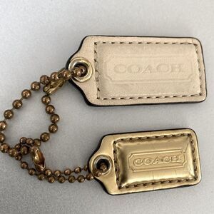 Coach Gold and Cream Keychain Bag Tags Set of 2